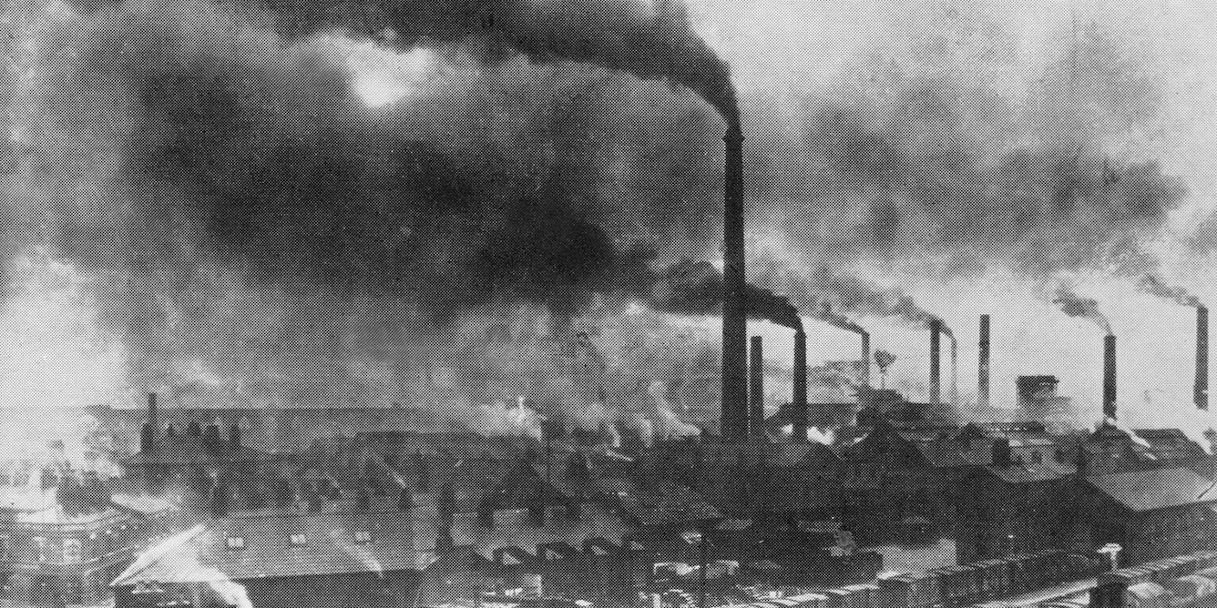 Factories polluting the air, land, and water.